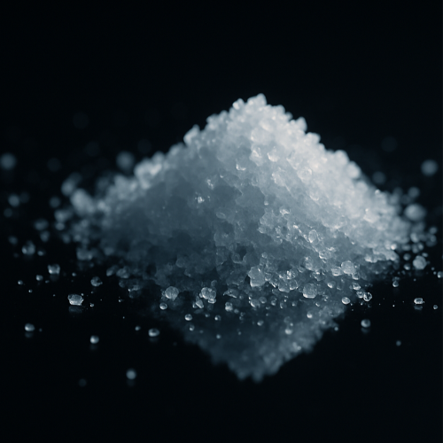 White granulated sugar on a black background